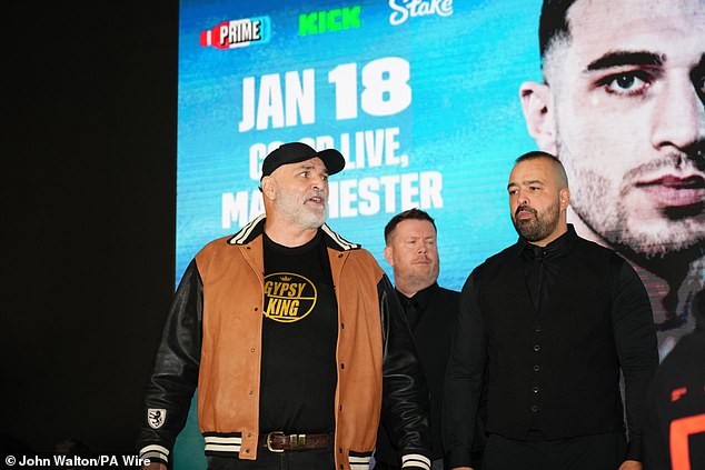 John Fury was seen throwing water in the direction of former UFC star Till during the pre-fight press conference last month.