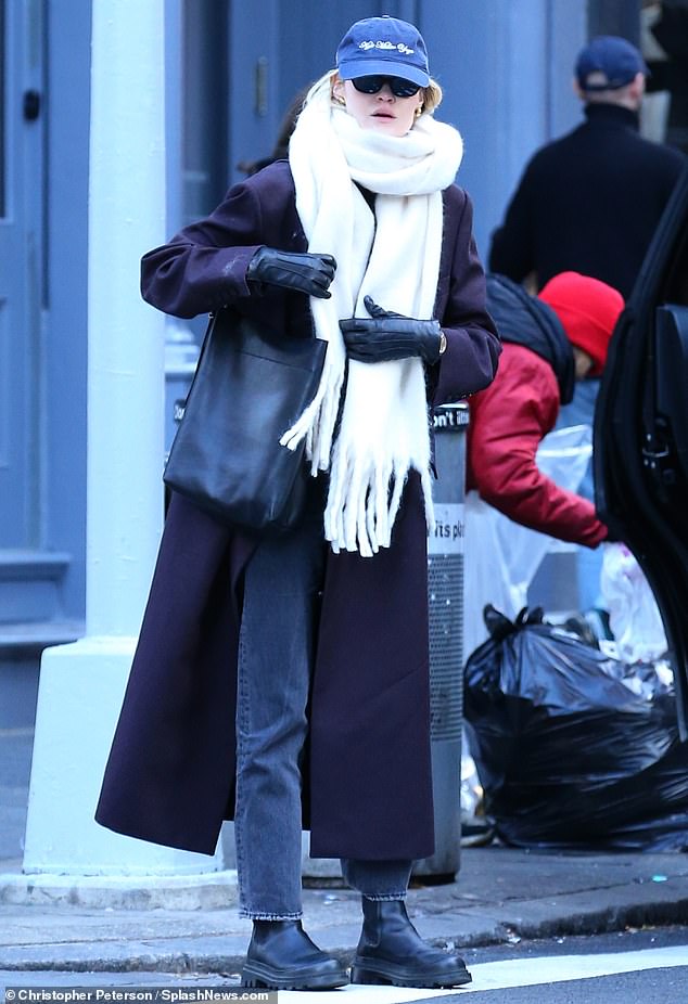 The 29-year-old founder of Guest in Residence wrapped a very long white scarf around her face and neck while walking through the city to brace herself for the freezing cold