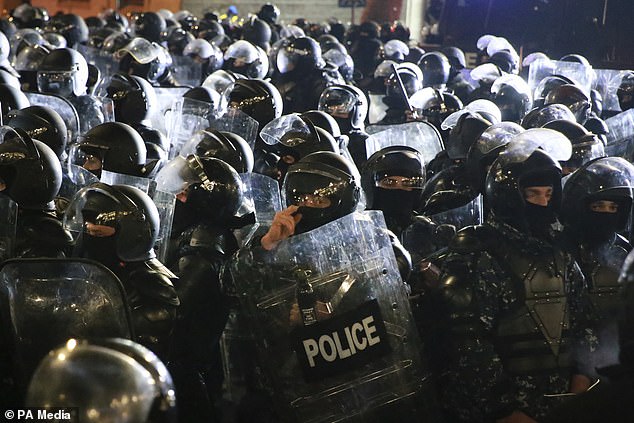 Riot police with shields (Zurab Tsertsvadze/AP)