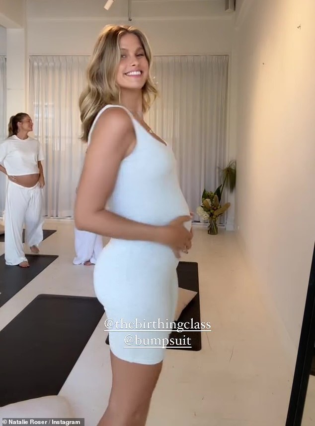 The beautiful model posed in a 'bump suit', a piece of sportswear that fit close to her figure