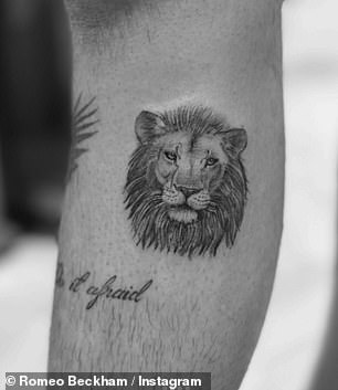 He also has a lion face on his arm above the words: 'Do it scared'