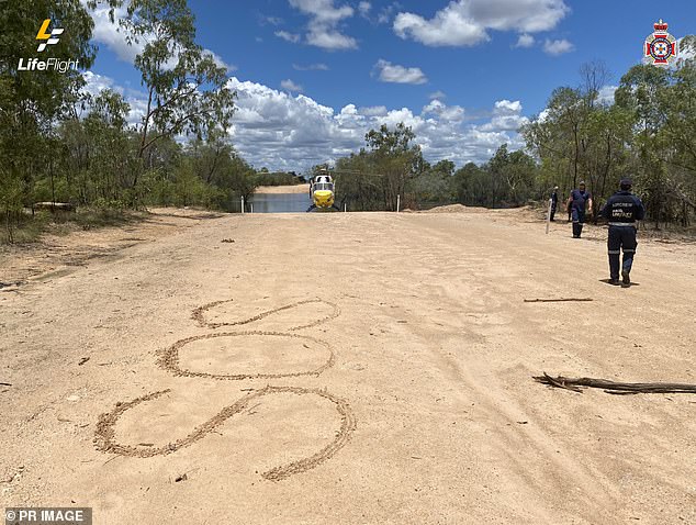 The pair spent three days without food and drinking only river water in the 40 degree Celsius heat as they were chased by a giant crocodile before rescue teams found them thanks to their large SOS signs.