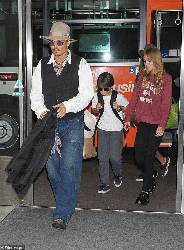 Johnny Depp pictured with his children Jack and Lily-Rose on holiday in Japan in 2013