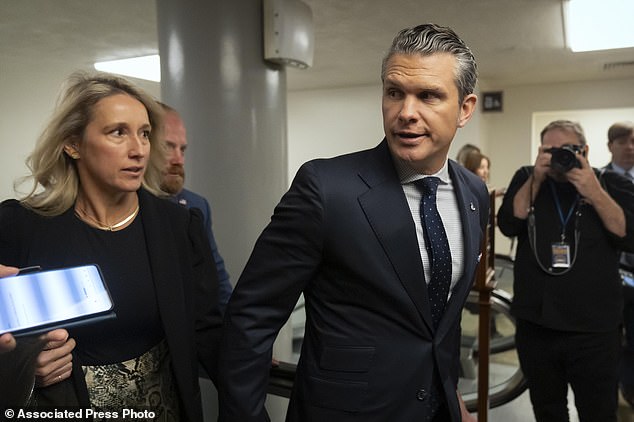 Pete Hegseth, President-elect Donald Trump's nominee for Secretary of Defense, is accompanied by his wife Jennifer Rauchet as they walk through the basement of the Capitol earlier this week