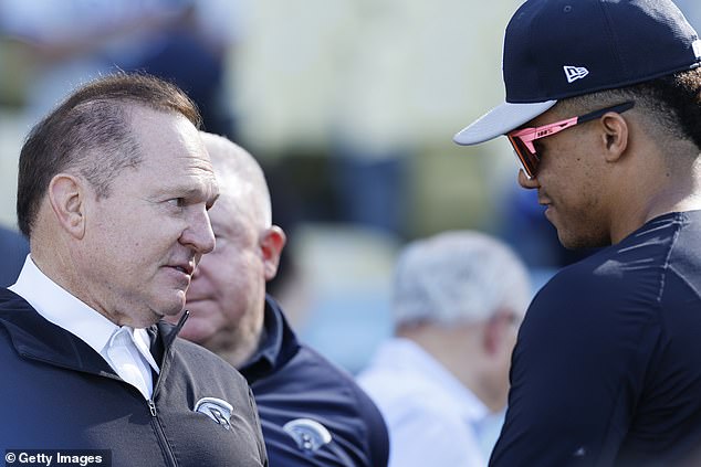 Agent Scott Boras (left) talks with his client, Juan Soto, during the 2024 World Series