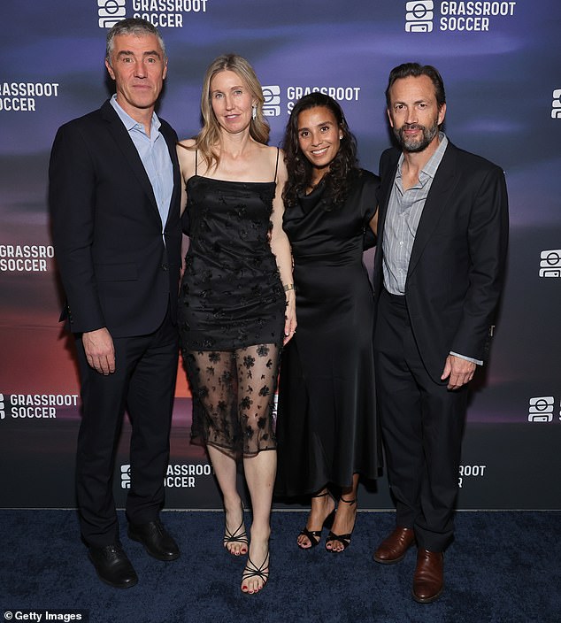 Shue, 57, and Fiebig, 47, appeared to be on a double date as they posed on the red carpet for a group photo with Tommy and Susanna Clark