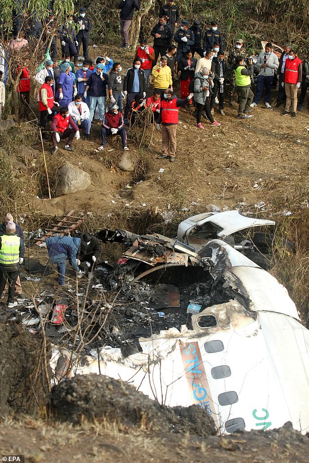 Rescue teams work at the crash site of a Yeti Airlines ATR72 aircraft in Pokhara, central Nepal