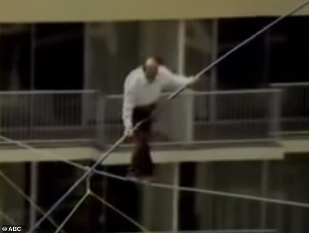 Karl Wallenda, 73, loses his balance before falling 115 feet while performing a high-wire stunt