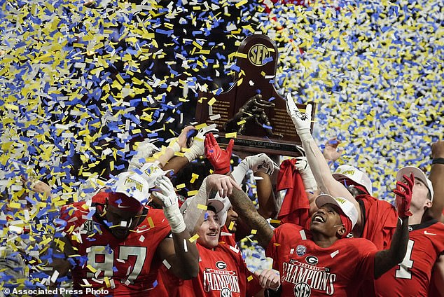 Georgia players celebrate the victory over Texas after the Southeastern Conference NCAA college football game