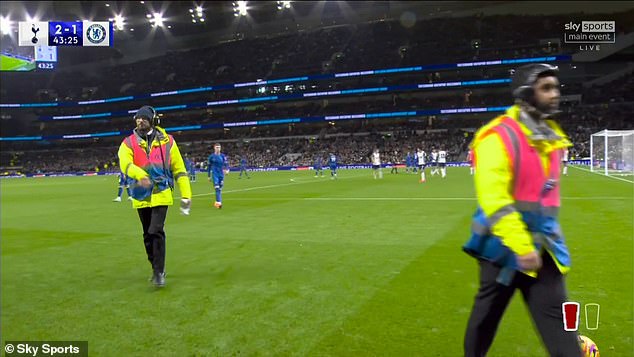 Tottenham stewards intervened to calm the fans and entered the pitch to remove objects