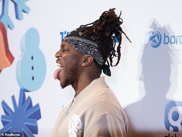 The rap star threw his tongue straight out as he arrived for the big music event this weekend