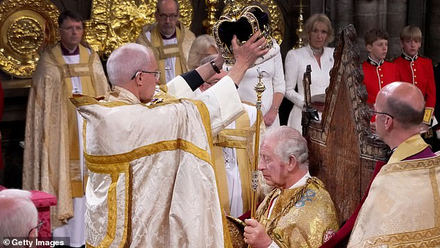 King Charles III is crowned with the St. Edward's Crown by the Archbishop of Canterbury, the Most Rev. Justin Welby, on May 6 last year