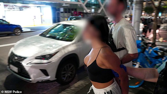 Among those arrested was a woman in Sydney's CBD, who was dragged into the back of a police van while wearing a revealing outfit.