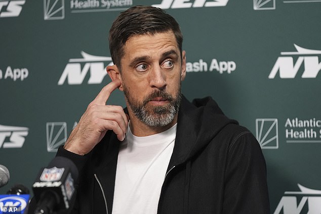 New York Jets quarterback Aaron Rodgers speaks during a press conference after the loss