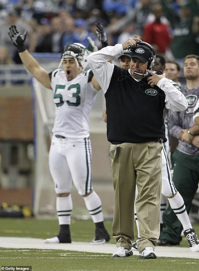 Rex Ryan and Josh Mauga of the New York Jets celebrate a 23-20 victory over the Detroit Lions at Ford Field on November 7, 2010. New York would reach the playoffs that season