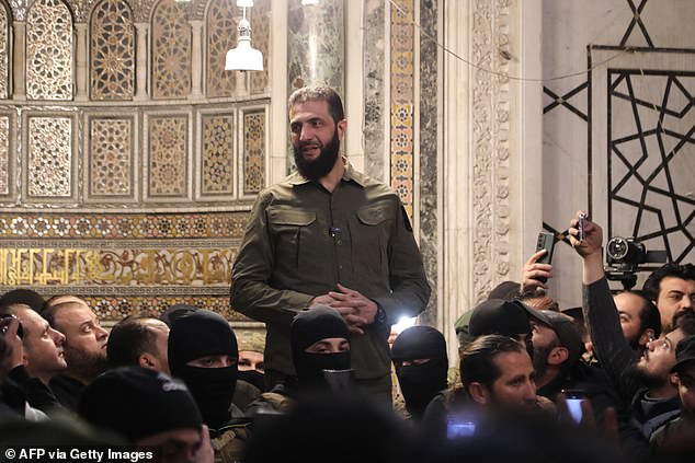 Rebel leader Abu Mohammed al-Jolani addresses a crowd at the Umayyad Mosque in the capital