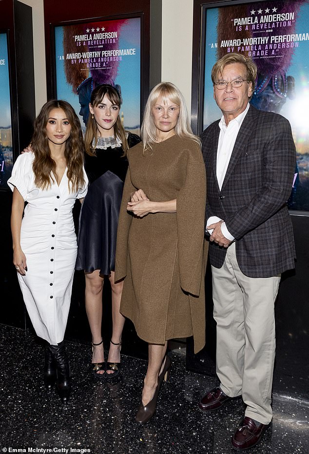 15-time Playboy cover girl, Brenda, and Kiernan were joined at the event by Oscar-winning screenwriter Aaron Sorkin (R)