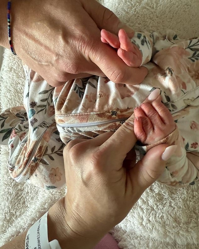 'She's here!! Gemma Britt Kufe,” the 38-year-old reality star shared via Instagram on Sunday, alongside an adorable photo of herself and her boyfriend Dr. Turner Kufe as they gently held their newborn baby's tiny hands