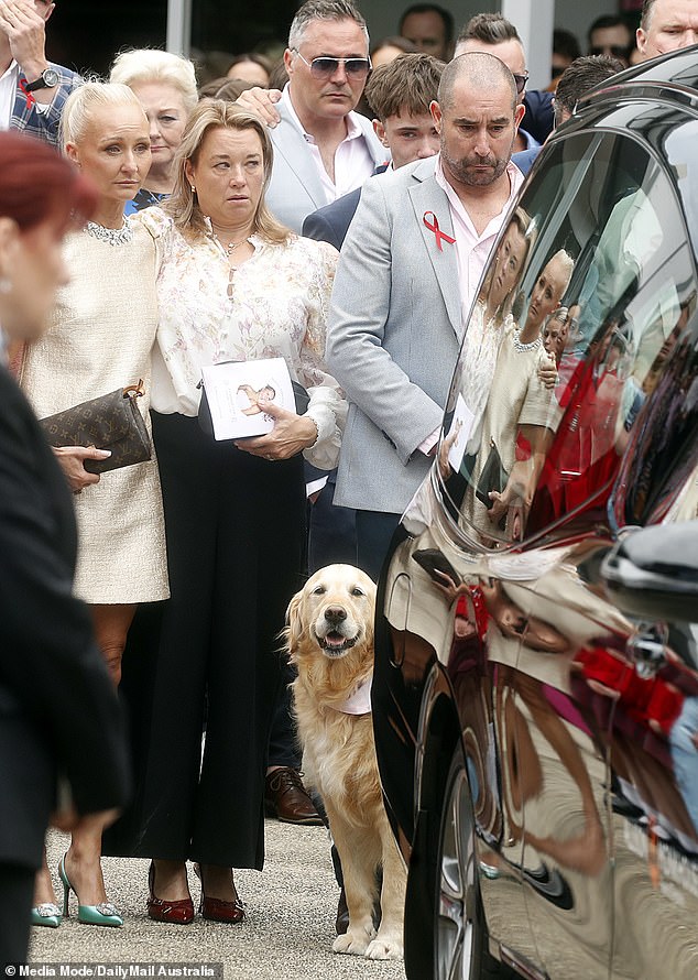 Bianca Jones' mother is seen on the left, supported by Holly Bowles' mother. The family's golden retriever, Zara, was also present