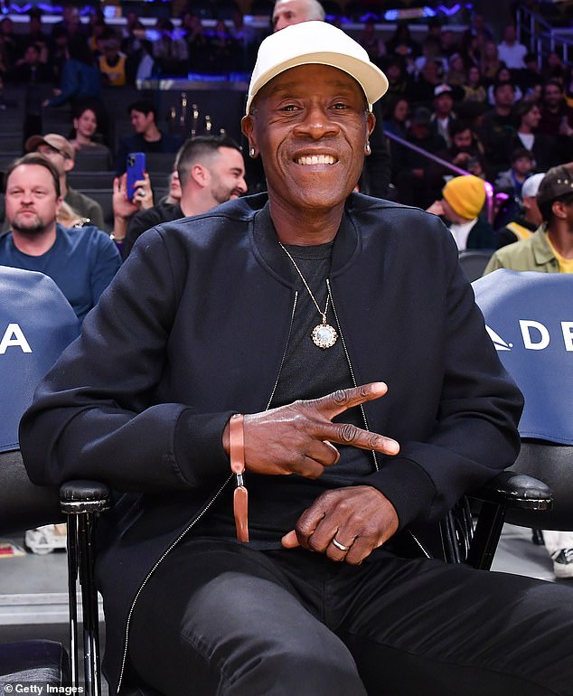 The actor, 54, joined a host of famous faces to watch the Los Angeles Lakers play the Portland Trail Blazers, including fellow movie star Don Cheadle (pictured)