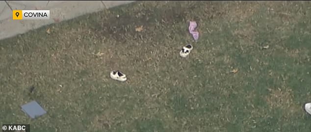 A pair of children's shoes were seen in the backyard of the house