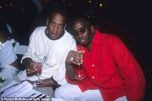 Jay-Z has been unmasked as the mysterious celebrity accused of raping a 13-year-old girl with Diddy at a VMA after-party in 2000, a lawsuit has revealed. (Image: Jay-Z and Sean Combs at Puffy's Fourth of July party at Sean Combs' House on July 2, 2000)