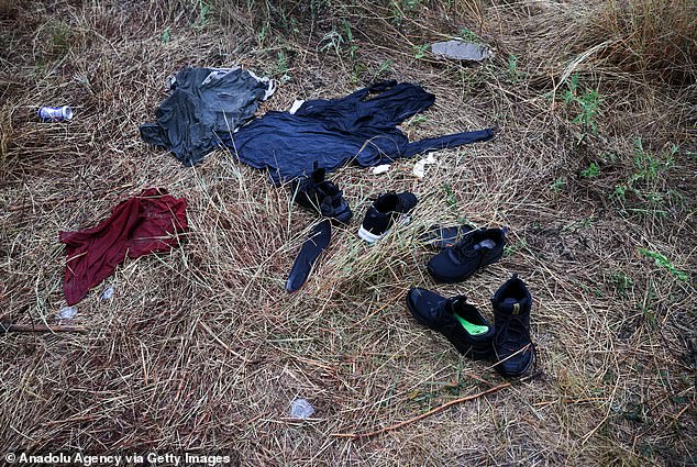 Shoes and clothes are seen in the area where an overcrowded truck was found with 46 dead migrants and 5 others died after being hospitalized in San Antonio, Texas