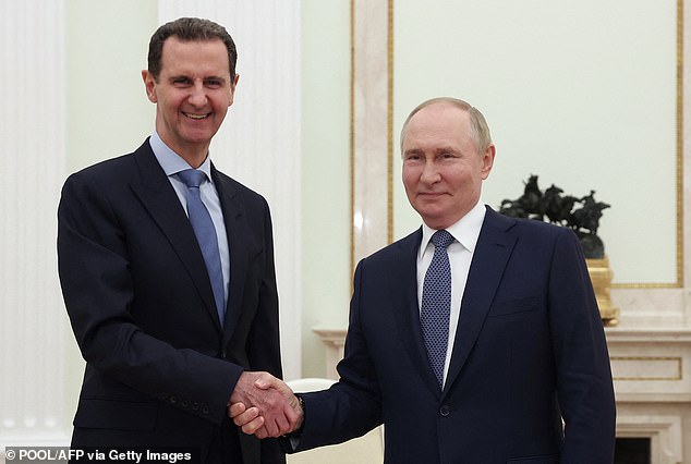 Russian President Vladimir Putin meets Al-Assad at the Kremlin in Moscow in July