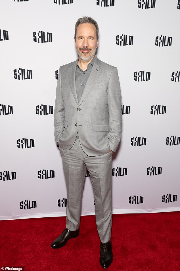 Denis Villeneuve, who directed Austin in Dune: Part Two, looked dapper in a light gray suit, although his tie-free, medium gray shirt looks faded