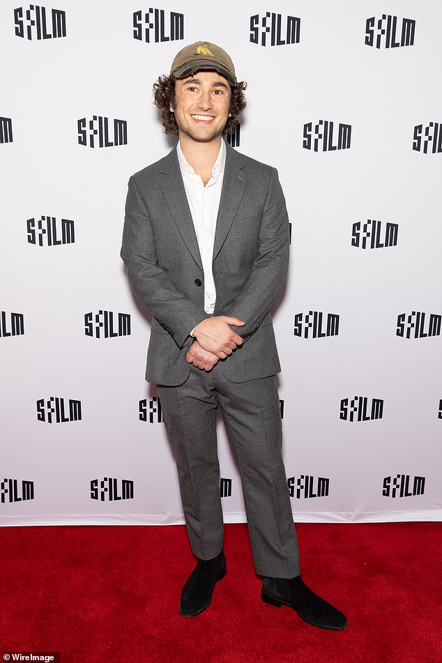 Gabriel LaBelle, who plays SNL creator Lorne Michael on Reitman's Saturday Night, looked smart in a dark gray suit with black suede Chelsea boots