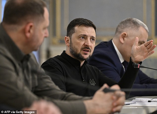 Ukrainian President Volodymyr Zelensky speaks with the leader of the German Christian Democratic Union (CDU) during their meeting in Kiev on December 9, 2024