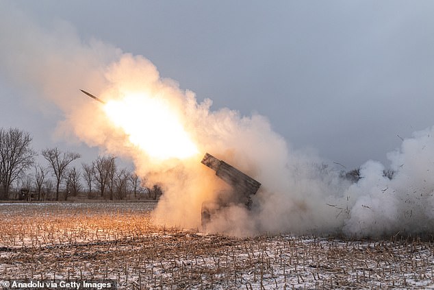 Ukrainian soldiers fire BM-21 artillery at their artillery battle position towards Kurakhove, Donetsk Oblast