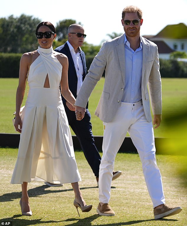 The Duchess of Sussex braved the grassy grounds in a pair of sky-high nude heels that put her at serious risk of sinking into the ground beneath her