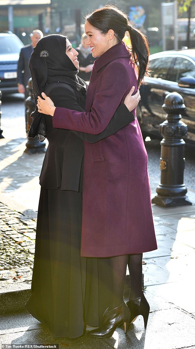 Meghan Markle was praised on US broadcast network CBS this weekend for being a 'big hugger' - a trait she has repeatedly demonstrated, including during a visit to the Hubb Community Kitchen in London in 2018 (pictured)