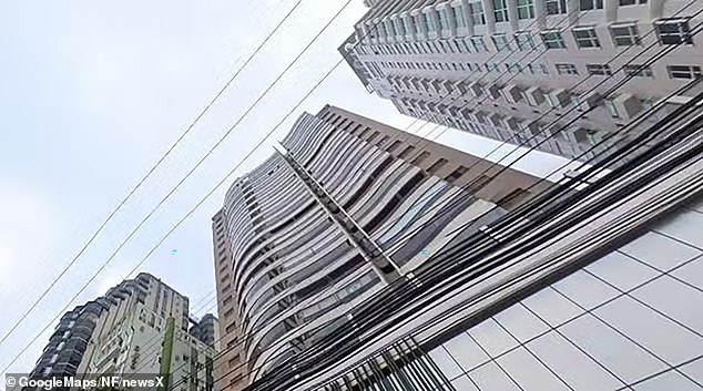 Police and firefighters later found her body at the foot of the Empire of the Sun Building (pictured) in Balneario Camboriu, Santa Catarina state.