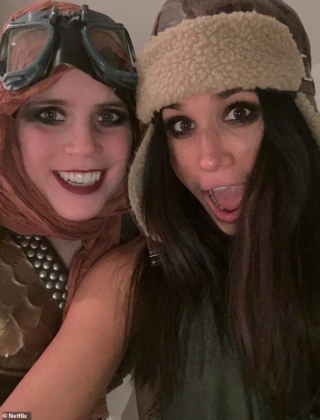 In another photo from their big night out, Meghan is seen posing for a playful selfie with Princess Eugenie