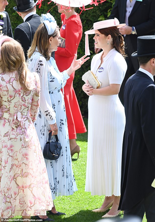 Princess Eugenie was also deep in conversation with Carole Middleton before the races started (pictured)