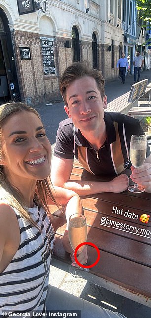 Meanwhile, another photo showed her drinking on a sidewalk cafe with an attractive male friend, and she was also not wearing her ring as she enjoyed a fun day out with her companion