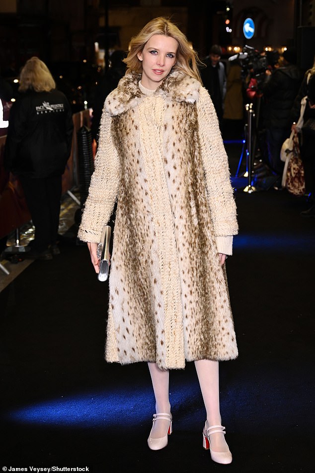 Greta Bellamacina looked sensational in a knitted white dress which she teamed with a long white fur vest with leopard print