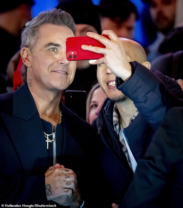 The singer was mobbed by fans as he walked the red carpet of the Royal Theater Tuschinski