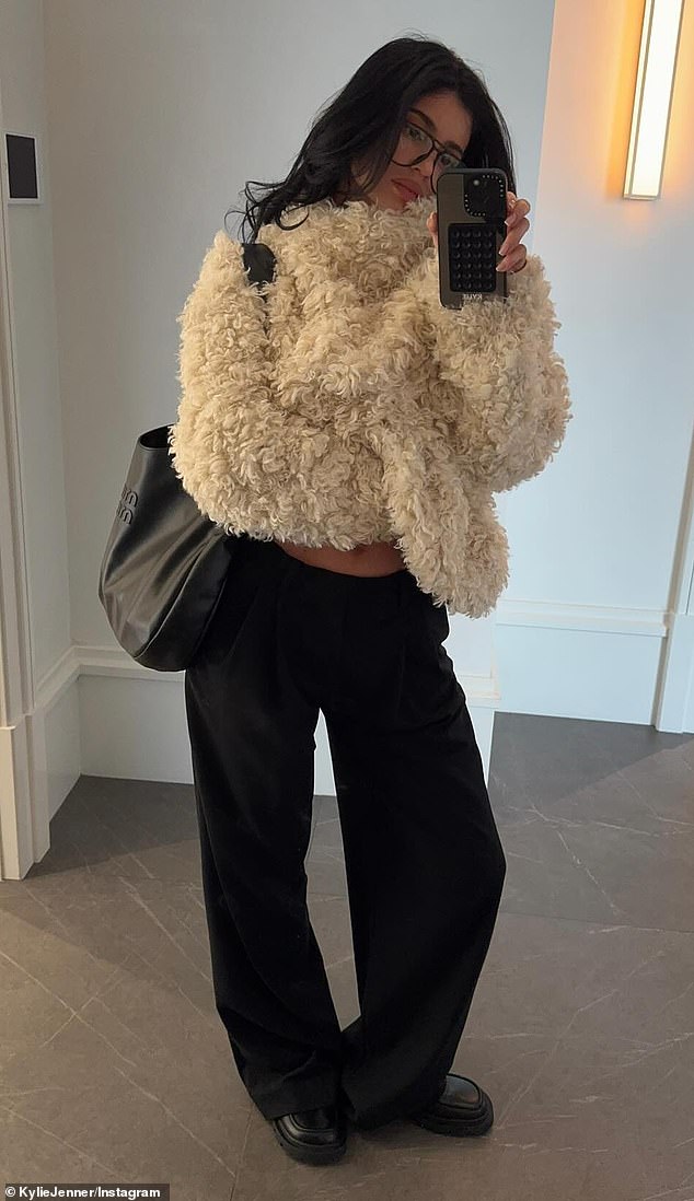 The 27-year-old business mogul uploaded photos and a video clip showing off a winter-ready outfit made up of pieces from her upcoming Khy drop