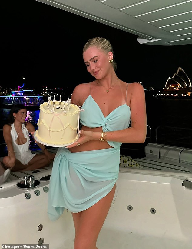 The birthday girl showed off her incredible figure in a sheer blue dress that resembled a bikini top and sarong as she jumped into the empty hot tub and started twerking