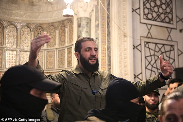 The leader of the Syrian Islamist group Hayat Tahrir al-Sham (HTS), Abu Mohammed al-Jolani, addresses a crowd at the capital's monumental Umayyad Mosque on December 8.