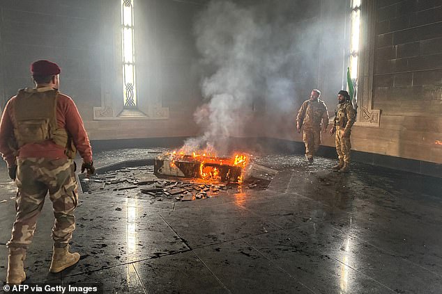 Rebel fighters set fire to Hafez al-Assad's grave. For the first time in sixty years, Syrians are looking to a future without the Assad family