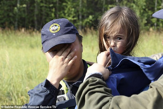 Her rescuer Artyom Borisov (pictured) admitted he could barely hold back his tears when he found her