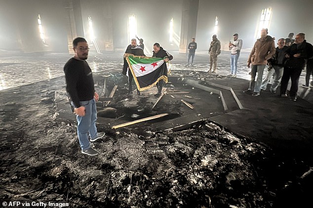 Rebels stormed the mausoleum today and set fire to Hafez al-Assad's grave