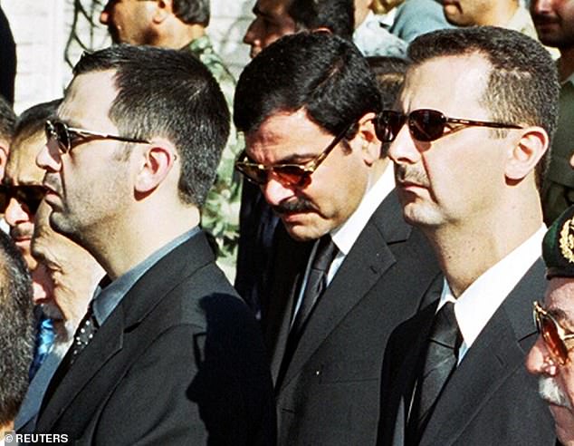 Syrian President Bashar al-Assad (right), his brother Maher (left) and brother-in-law Major General Assef Shawka during the funeral of Hafez al-Assad