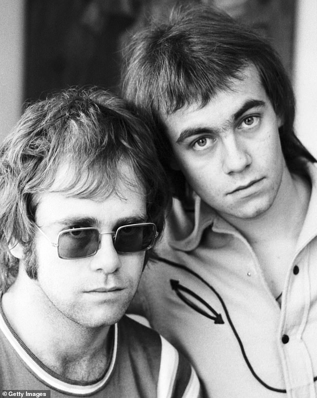 The Tiny Dancer singer explained that he had also wanted to leave his childhood behind and opted for a completely different name to adopt a new personality and block out unhappy memories (pictured with Bernie Taupin 1970)