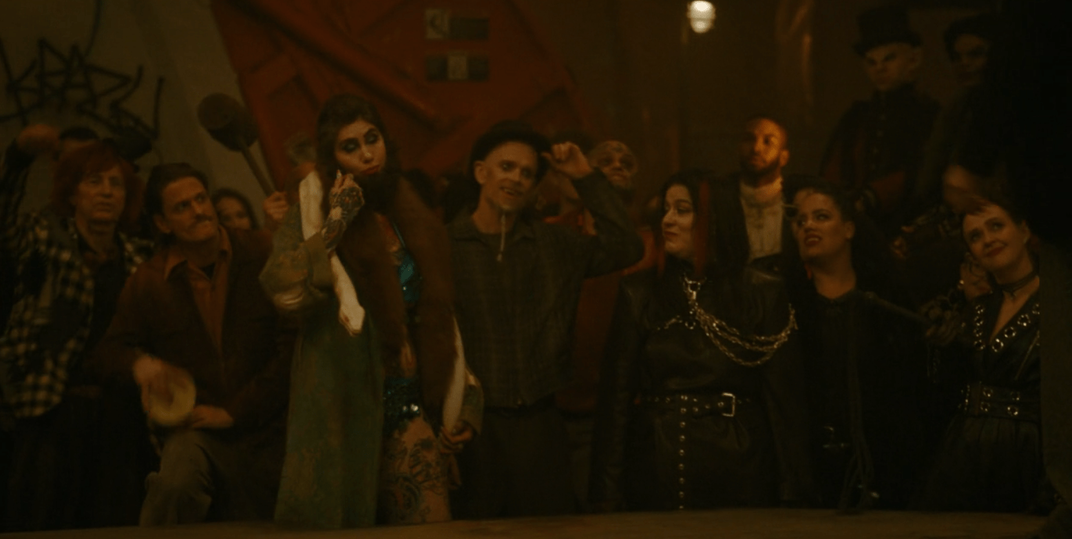 A group of Carnies alongside some vampire ladies in leather in What We Do in the Shadows