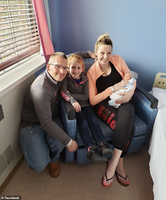 Elizabeth Dominguez (right) was temporarily separated from her newborn son Carter after eating a poppy seed bagel, which caused her to test positive for opiates. She is pictured having been reunited with her baby, along with her husband and eldest daughter